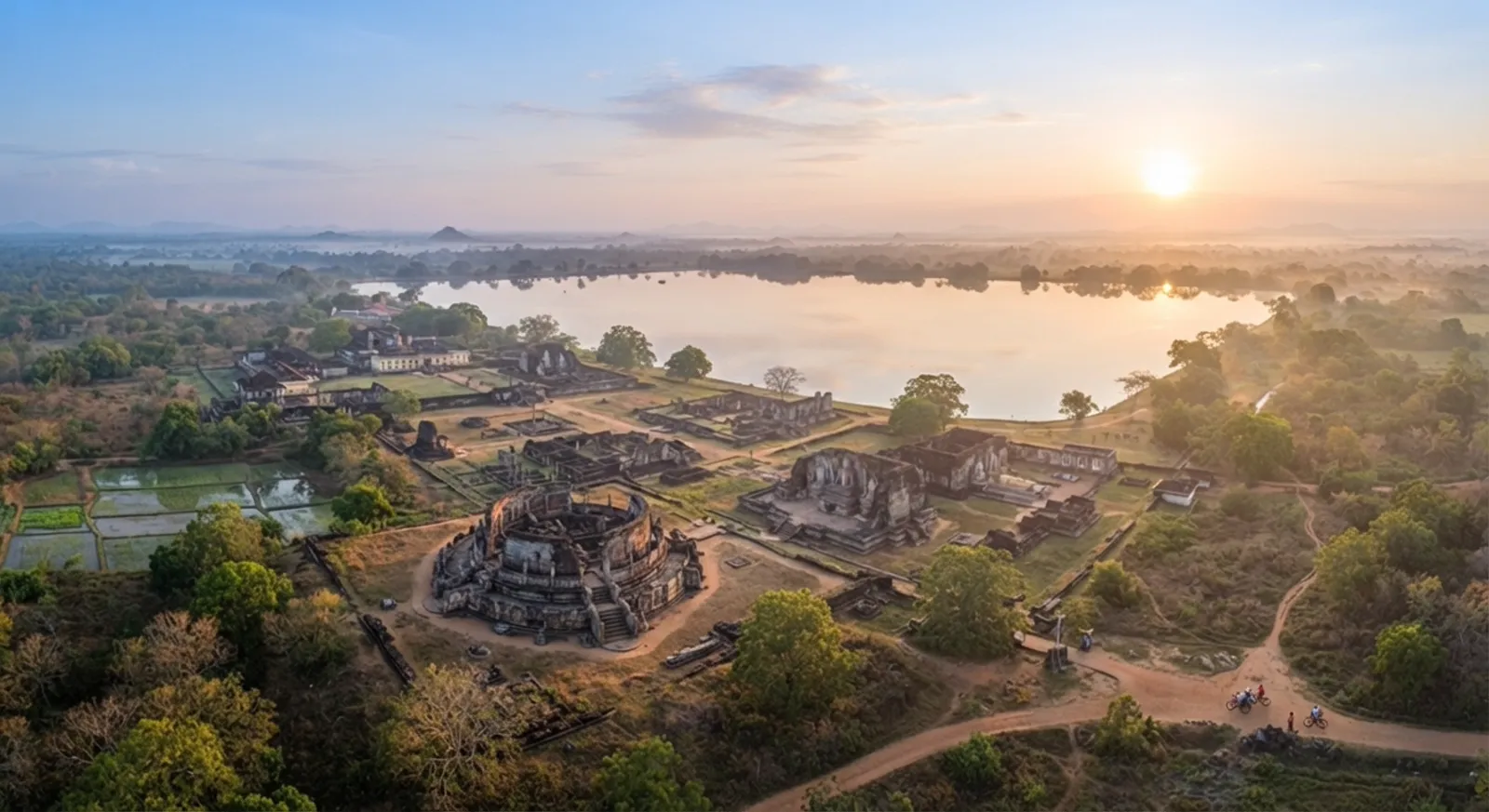 Ancient ruins of Polonnaruwa at sunrise, beside a lake in Sri Lanka's cultural triangle